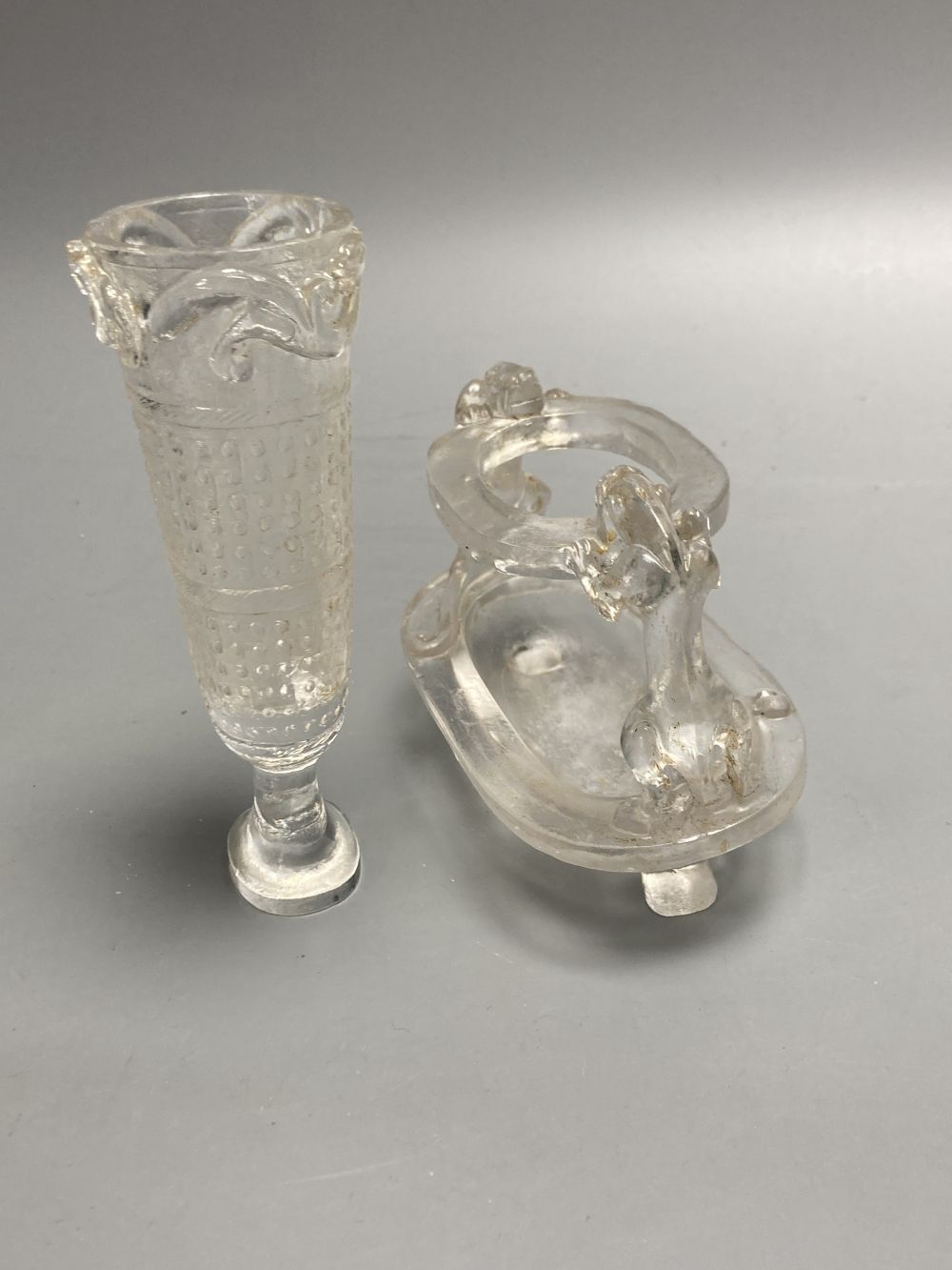 A Japanese Kakiemon dish, 17th century, a similar wine cup, 18th century and a Chinese glass vase and stand, tallest 14cm